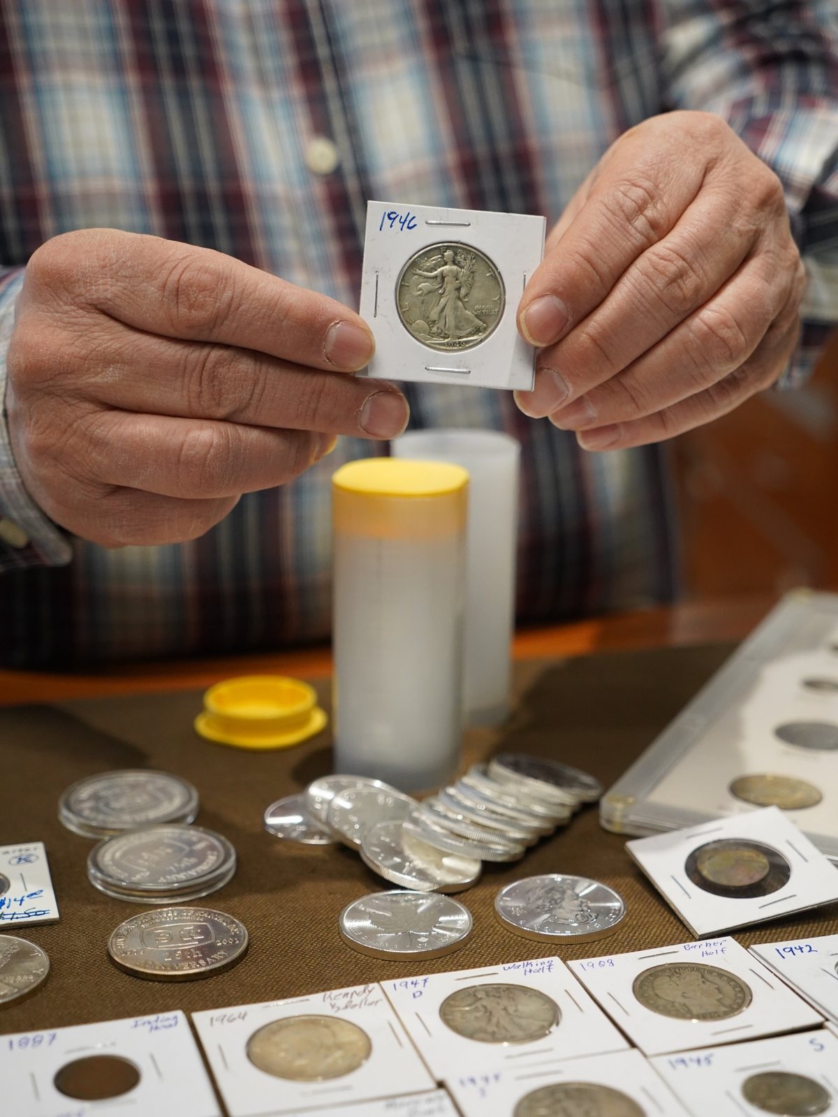 Collectible coins in flips at the counter